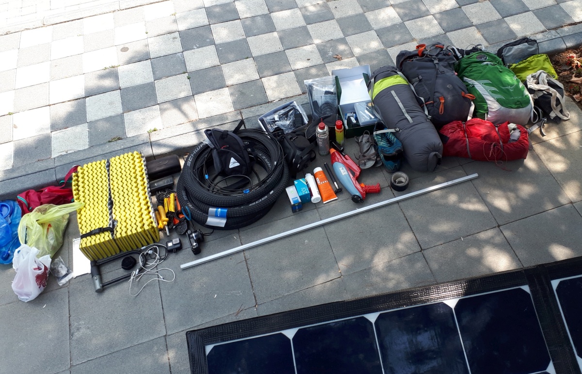 I took the opportunity while waiting for the ferry to strip down the trike so that I could replace the shifter cable housing on the Rohloff hub with compressionsless housing. That required taking EVERYTHING off the trike, which gave us a chance to appreciate just how much we were hauling.